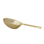 Gold metal scoop with a long handle and a circular loop at the end