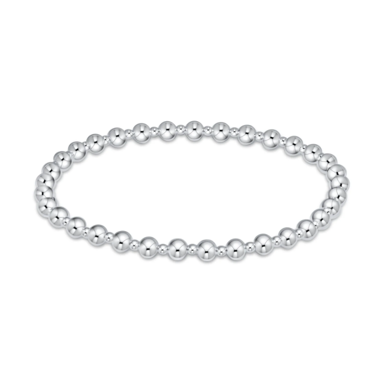 Sterling silver bead bracelet composed of uniformly sized polished spherical beads forming an open oval shape on a clean white background