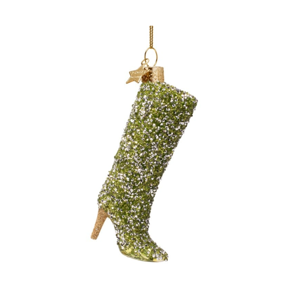 Glass Christmas ornament of a tall high-heeled boot shimmering with green and silver rhinestones featuring a golden glitter heel and a gold chain hanger with a star charm