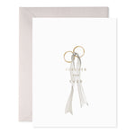 Greeting card with two gold rings tied with a white ribbon and the text Forever and Ever
