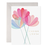 Greeting card with watercolor flowers and gold text reading Sending Love