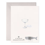 Back of greeting card with watercolor illustration of a coupe glass and whale shaped barcode
