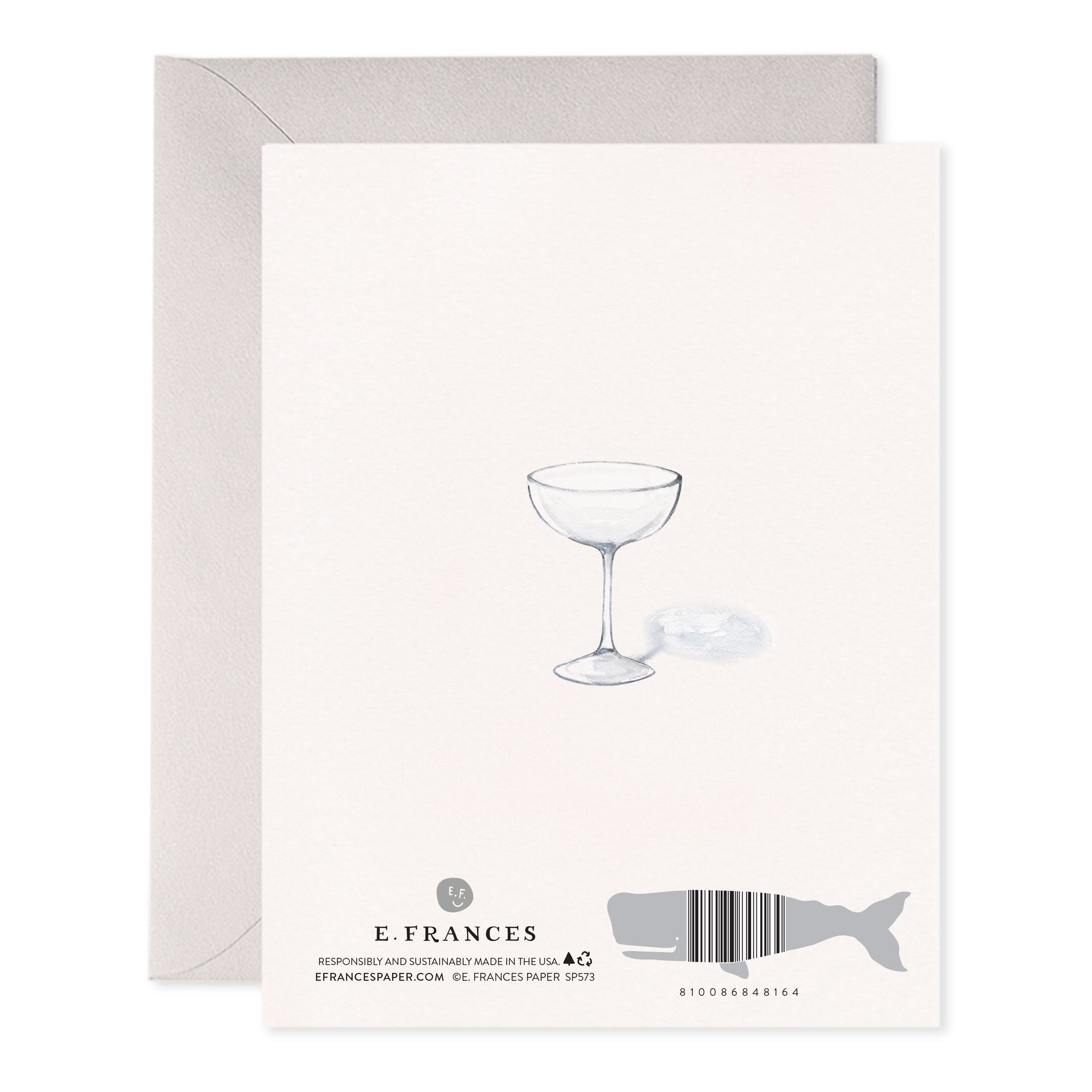 Back of greeting card with watercolor illustration of a coupe glass and whale shaped barcode