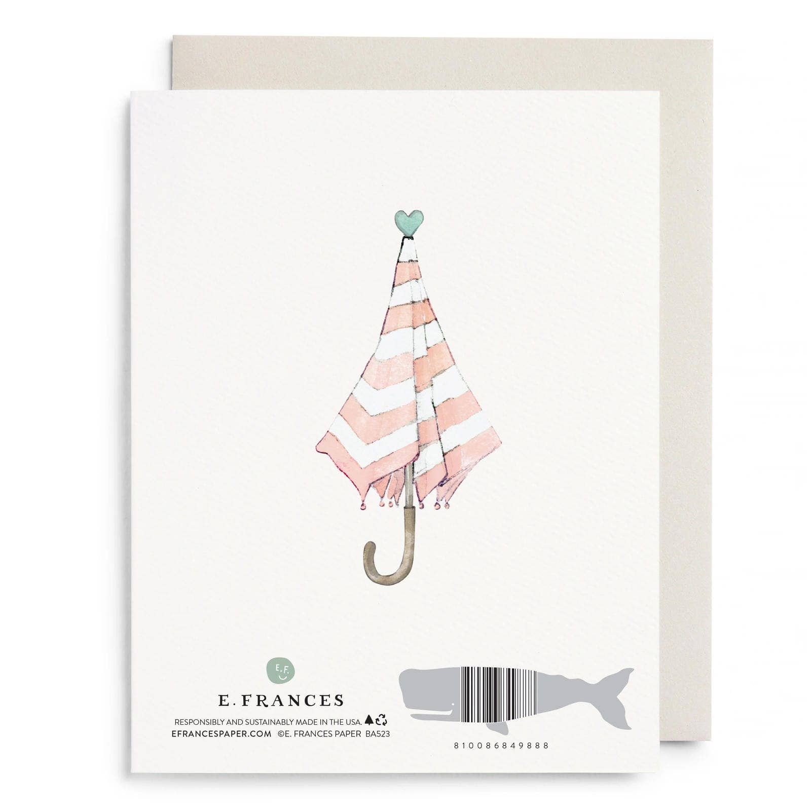 Greeting card back with pink and white striped umbrella illustration and whale shaped barcode