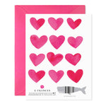 Greeting card back with twelve pink watercolor hearts and a whale shaped barcode