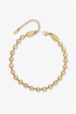 Gold jewelry, a polished ball chain bracelet featuring uniform spherical beads, a classic lobster claw clasp, and an adjustable extender chain