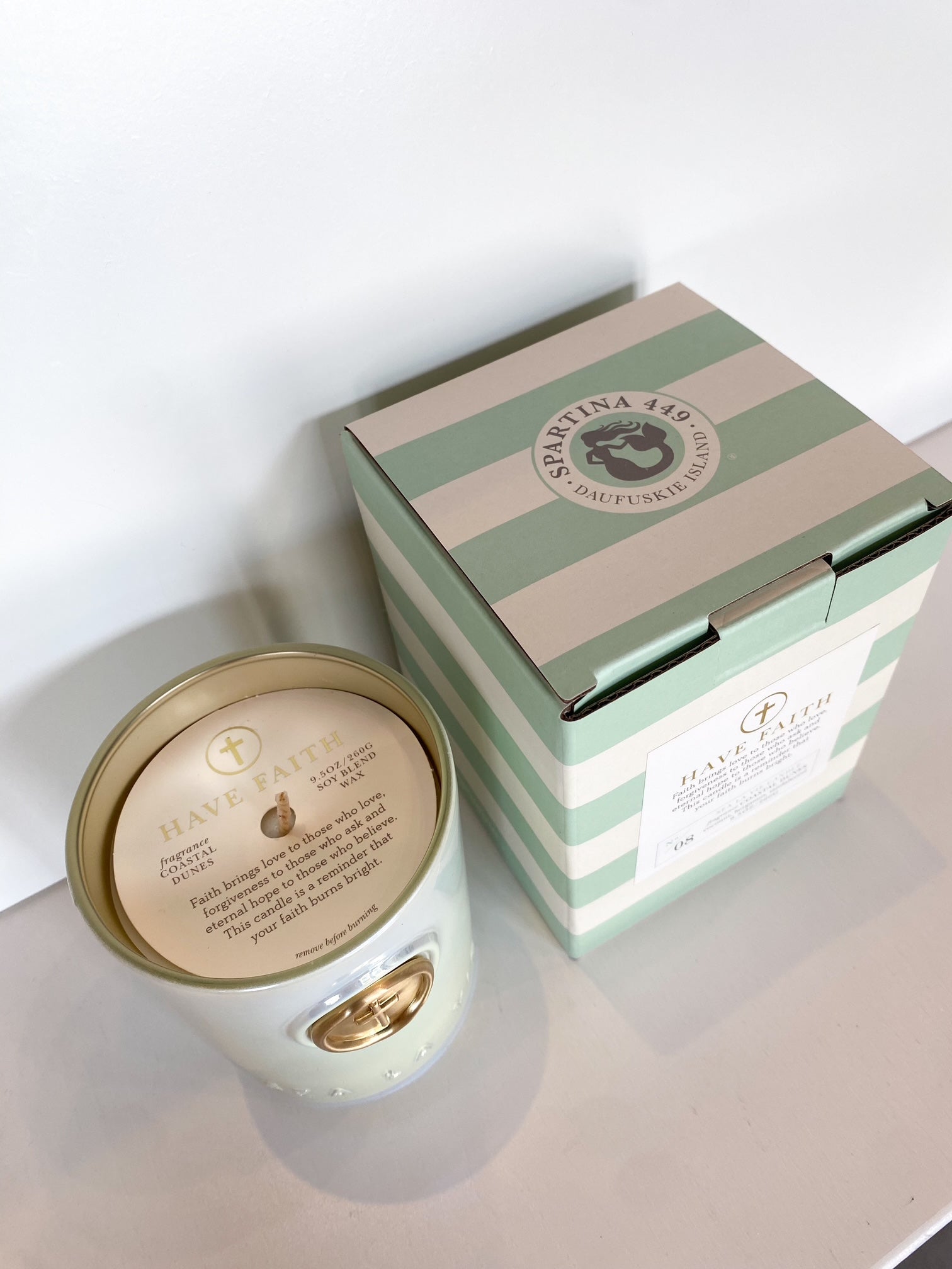 Have Faith scented candle in a striped box with Spartina 449 logo
