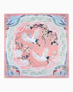 Oh My Mahjong printed mat featuring two white cranes with blue-tipped wings flying through white blossoms on a peach-pink background surrounded by mint green borders with Charleston gameplay instructions