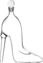 Clear glass decanter in the shape of a stylish women's high-heeled shoe featuring a stiletto heel and a round stopper