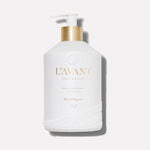 L'AVANT Collective High Performing Dish Soap bottle in white with a gold pump and cap, featuring gold L'AVANT Collective branding and Blushed Bergamot scent, set against a plain background with a unique textured ribbed base