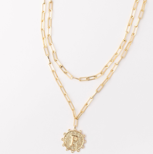 Gold layered paperclip chain necklace with a textured circular pendant featuring the letter P