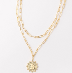 Gold layered paperclip chain necklace with a textured coin pendant featuring the letter B