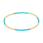 Stretch bracelet with alternating gold beads and turquoise seed beads