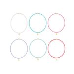 Six colorful beaded bracelets with gold cross charms arranged in two rows
