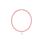 Beaded resin bracelet featuring a circular string of vibrant red beads on a black background, accented by a polished gold cross charm and a single spherical gold bead at the top