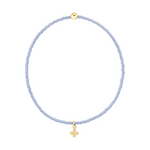 Light purple beaded bracelet with a gold cross charm and a gold bead