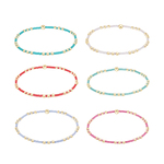 Six colorful beaded stretch bracelets with gold accents arranged in two rows