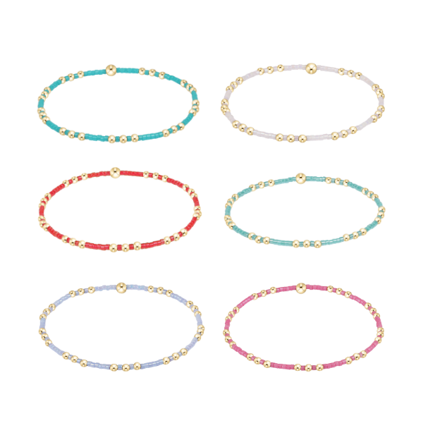 Six colorful beaded stretch bracelets with gold accents arranged in two rows