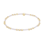 Stretch bracelet with gold beads and small white glass seed beads