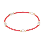 Red beaded bracelet with gold spheres and white pearls