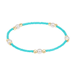Turquoise beaded bracelet with gold and pearl accents
