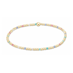 Delicate gold-toned beaded bracelet with interspersed pastel pink light blue white and turquoise enamel beads and a central larger gold bead