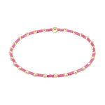 Stretch bracelet with alternating pink seed beads and gold metal beads