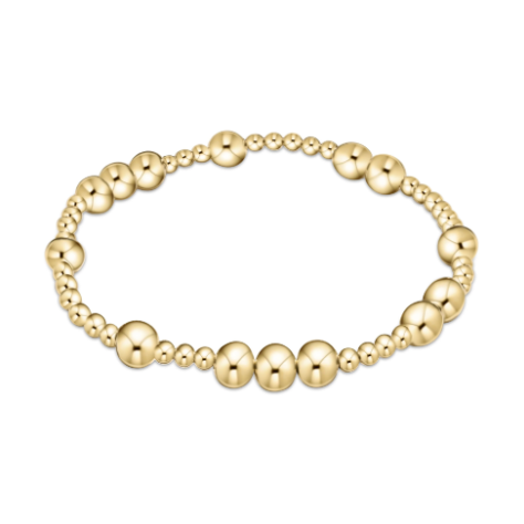 Polished gold beaded stretch bracelet featuring alternating large and small round beads