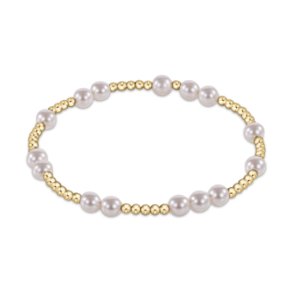 Stretch bracelet with alternating gold beads and white pearls
