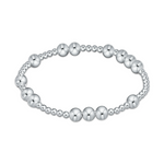 Stretch bracelet made of polished silver beads of varying sizes