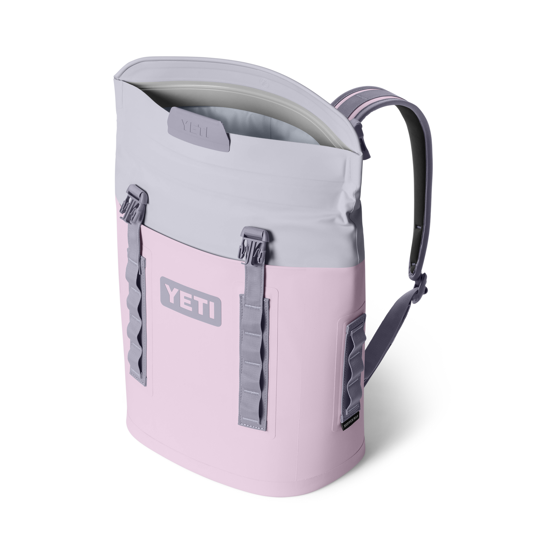 YETI Hopper M20 backpack cooler in blush pink with gray shoulder straps, open MagShield Access, and side HitchPoint Grid webbing