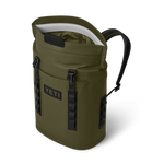 YETI Hopper M30 soft cooler backpack in Highlands Olive green color featuring an open magnetic top, black padded shoulder strap, and prominent YETI logos