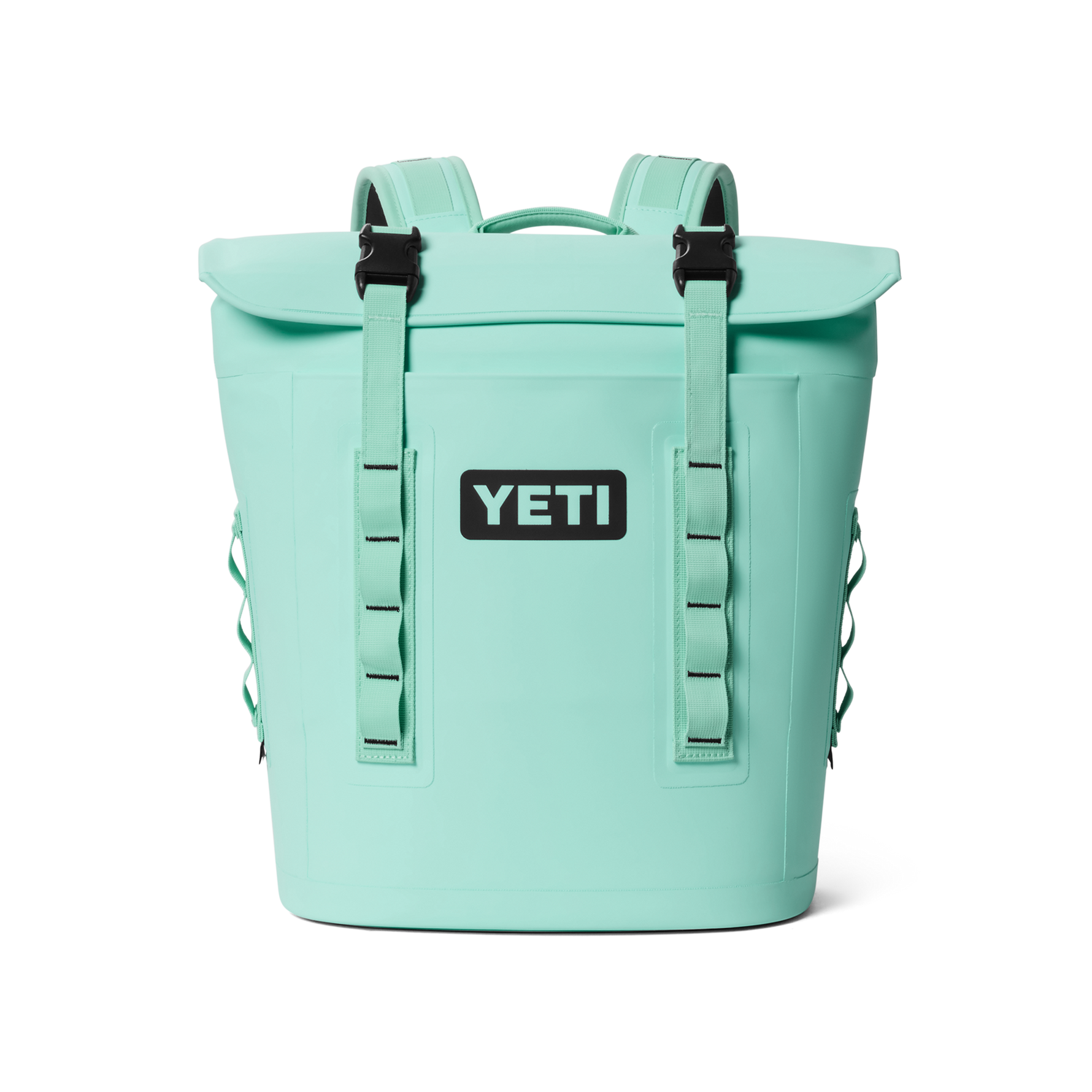Mint green Yeti Hopper M20 Backpack Soft Cooler featuring a prominent black Yeti logo, a roll-top magnetic closure, and black buckles on its shoulder straps along with side webbing loops
