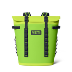 YETI Panga 28 waterproof backpack cooler in vibrant lime green featuring a secure roll-top closure, black webbing straps, and a prominent YETI logo