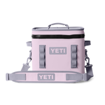 YETI Hopper Flip soft cooler in blush pink with grey YETI logo, durable black zipper, and adjustable grey shoulder strap