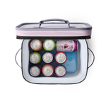 A top-down view of an open pink and grey YETI cooler bag containing a blue YETI ice pack and eight colorful beverage cans including a Waterloo Pomegranate Acai sparkling water can
