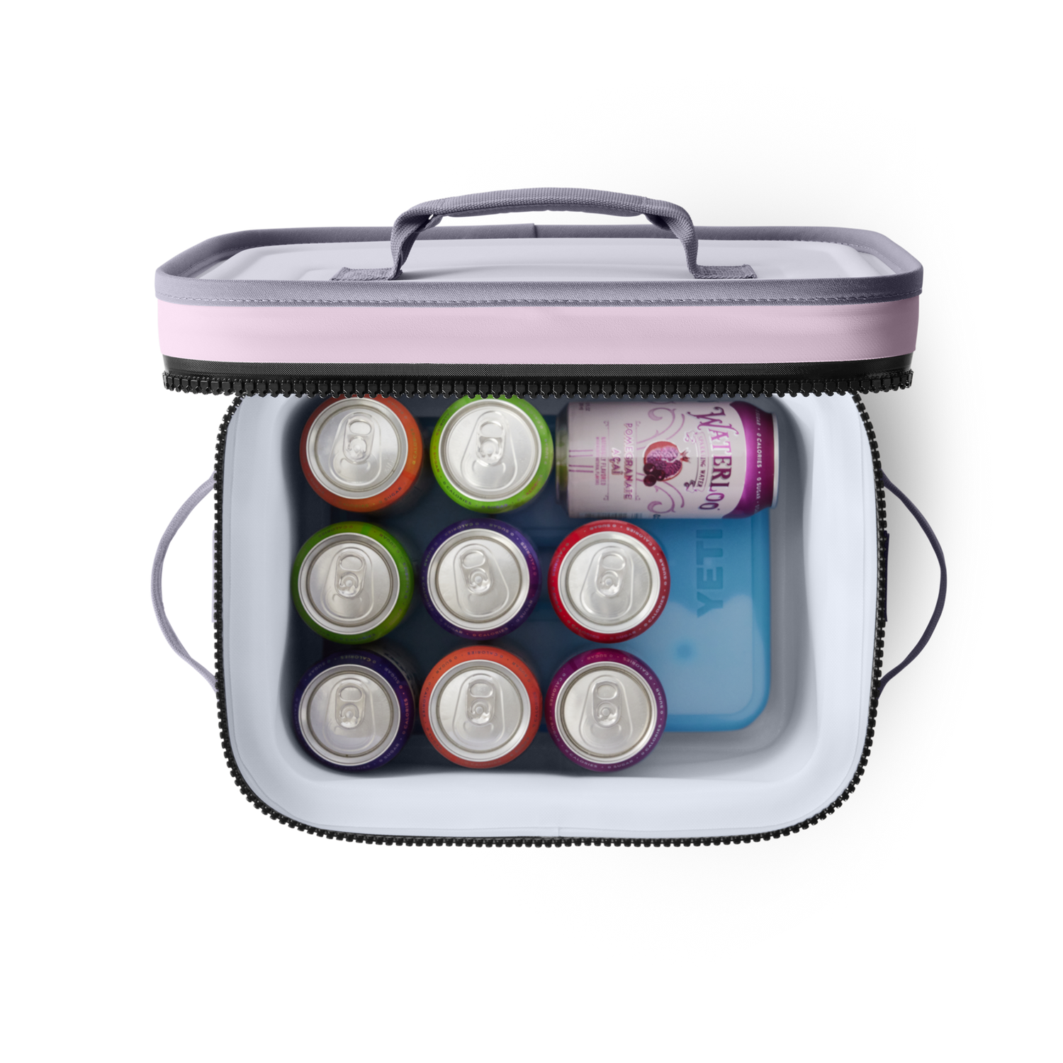 A top-down view of an open pink and grey YETI cooler bag containing a blue YETI ice pack and eight colorful beverage cans including a Waterloo Pomegranate Acai sparkling water can