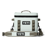 Product photo of a mint green Yeti Hopper Flip 8 Soft Cooler on a black background featuring a black YETI logo dark gray handles and a waterproof black zipper