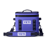 Product photography of a vibrant purple Yeti soft cooler bag featuring a white Yeti logo, durable black top zipper, and an adjustable shoulder strap