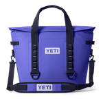 Vibrant purple Yeti soft cooler tote bag with a waterproof roll-top closure, black adjustable shoulder strap, and a prominent white YETI logo on the front and strap pad