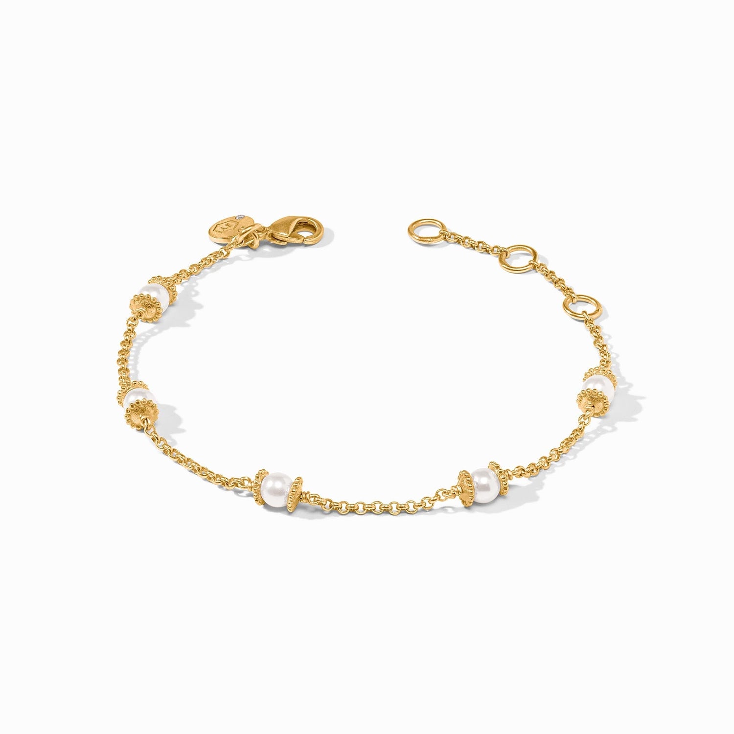 Gold chain bracelet featuring spaced white pearls with textured gold bead accents