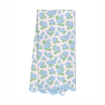 Textile pattern featuring scattered blue hydrangeas with green leaves on a light pink pinstriped background with a distinctive scalloped light blue border