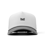 Front view of a white baseball cap featuring a dark gray geometric logo on the textured front panel and a braided gray and white rope accent above the gray brim
