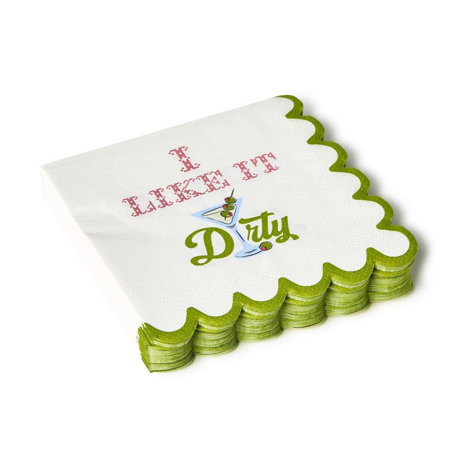 A stack of white paper cocktail napkins with scalloped bright green edges featuring the playful phrase I LIKE IT Dirty in pink cross-stitch and green script with a martini glass illustration holding three olives
