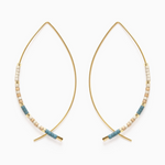 Jewelry a pair of modern gold-toned wire hoop earrings adorned with petite rectangular beads in teal, beige, and cream