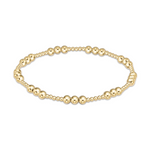 Gold beaded stretch bracelet with varying bead sizes