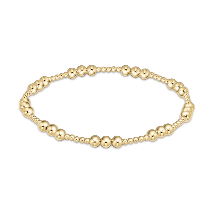 Gold beaded stretch bracelet with varying bead sizes