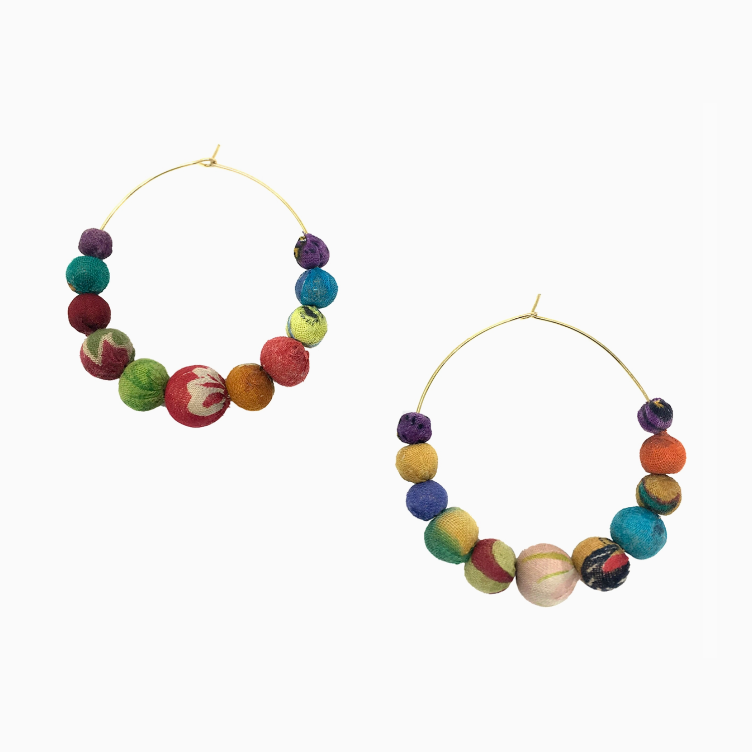 Two handcrafted gold-tone hoop earrings adorned with multiple small round colorful fabric beads featuring various patterns and textures