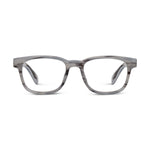 Studio shot of a modern rectangular-frame pair of eyeglasses featuring thick, striated gray acetate and clear lenses