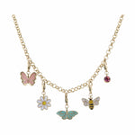 Gold charm necklace on a white background featuring a pink butterfly charm a white daisy charm and a yellow and black striped bee charm